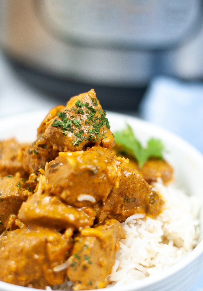 Close view of chicken in butter sauce. 