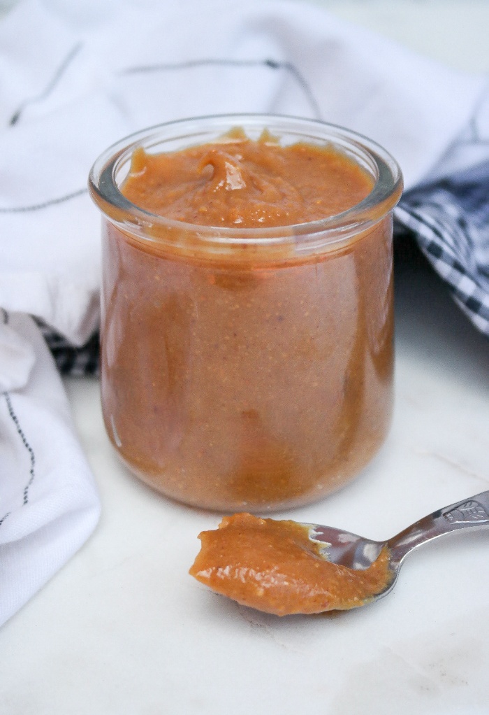 Peanut butter drizzle in a clear glass jar. 