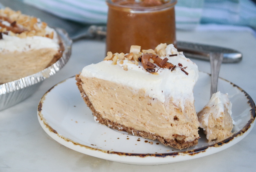 A slice of sugar free pie made with whipped cream and peanut butter. 