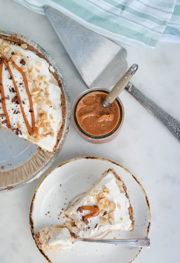 A top view with a slice of pie and part of a full pie.