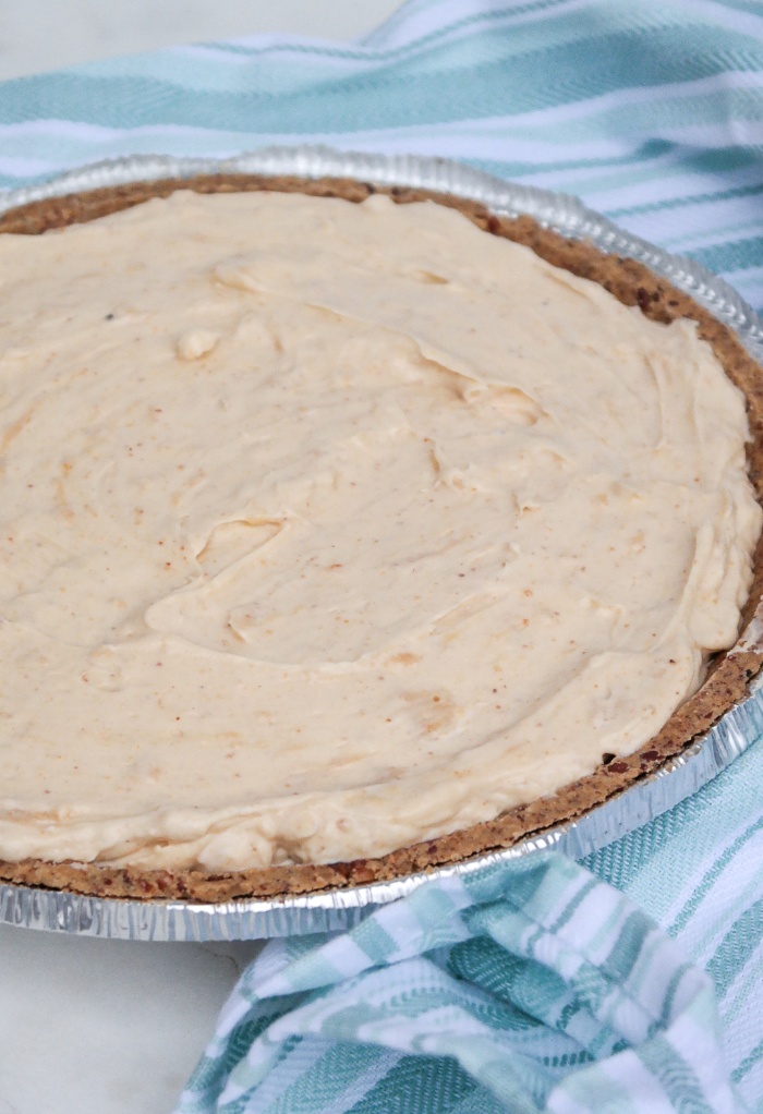 Peanut butter pie filling in a prepared pie crust.