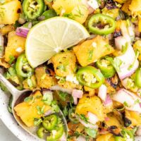 Jalapeno pineapple salsa in a white bowl ready to be served.