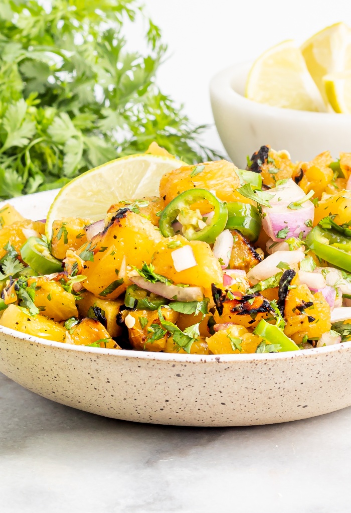 Pineapple salsa in a cream bowl. 