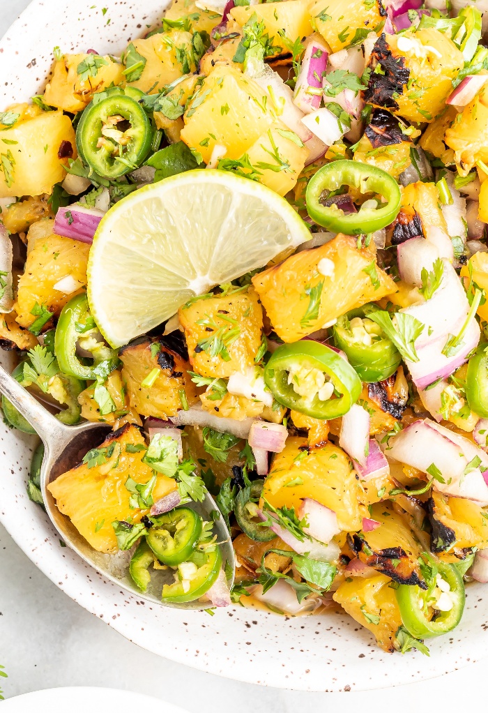 Jalapeno pineapple salsa in a white bowl ready to be served. 