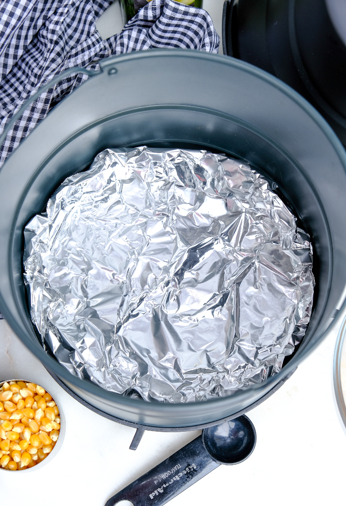 Aluminum foil on the bottom of the basket of an air fryer.