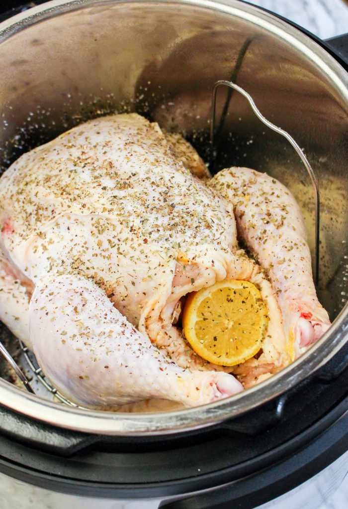 Whole chicken in an Instant Pot ready to cook.