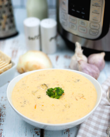 Keto broccoli cheese soup in a white bowl made in an Instant Pot.