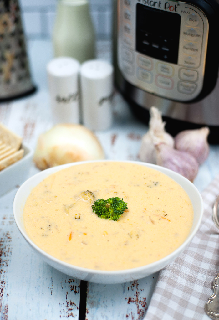 Keto broccoli cheese soup in a white bowl made in an Instant Pot. 