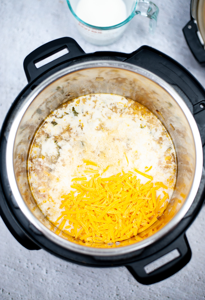 Ingredients in an Instant Pot for Keto Broccoli Cheese Soup Recipe.