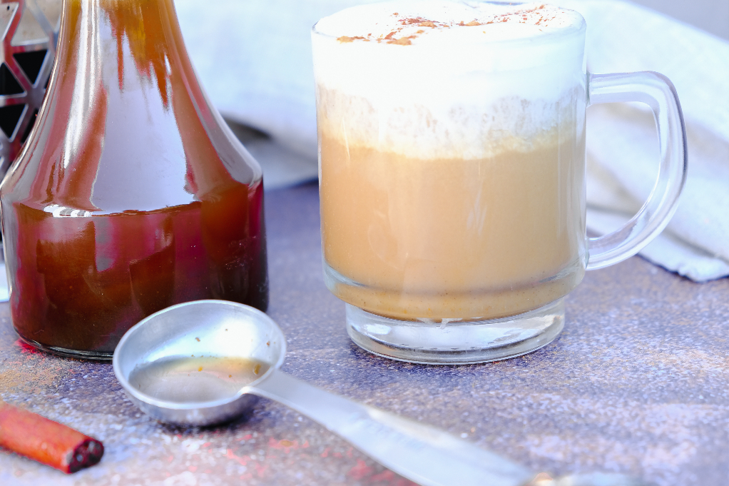 A tablespoon full of syrup to add to coffee as a sweetener.