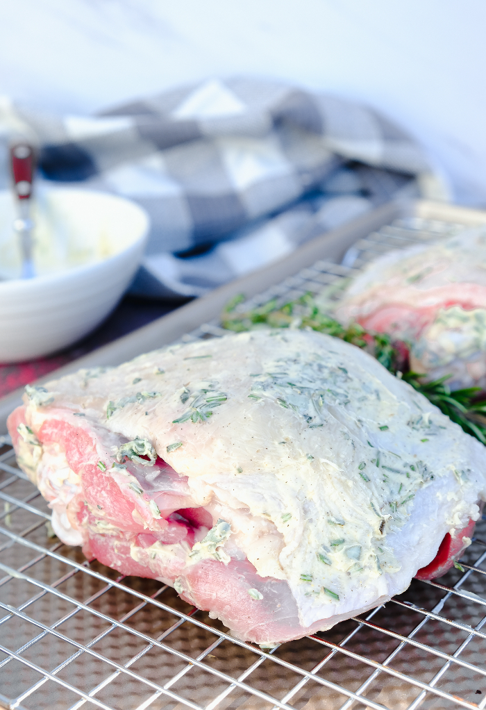 Turkey thighs on a baking sheet ready to roast.