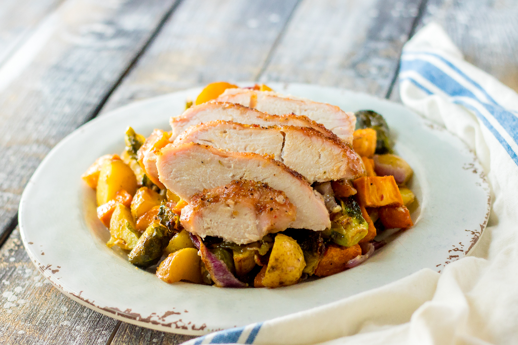 Turkey and vegetable dinner on a white plate.