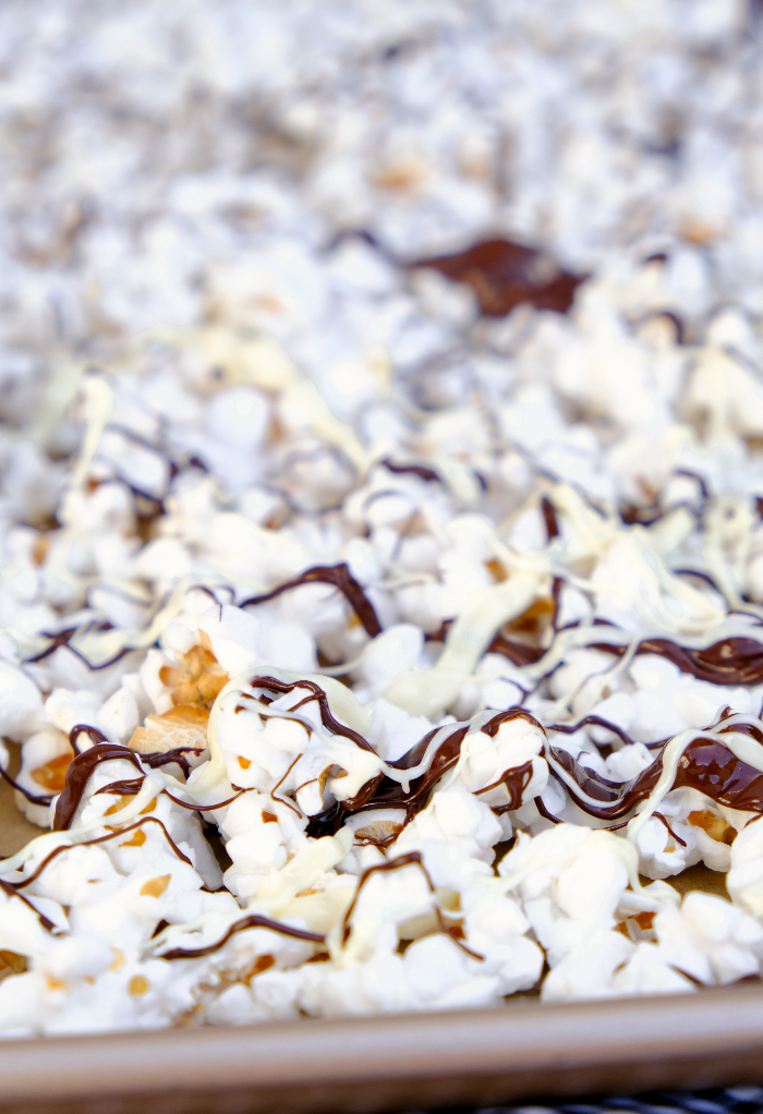 Drizzled chocolate over fresh popped popcorn.
