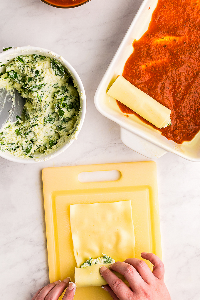 Adding ricotta cheese on noodles before placing in a casserole.