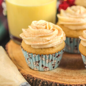 Eggnog cupcakes with buttercream frosting and a sprinkle of cinnamon.