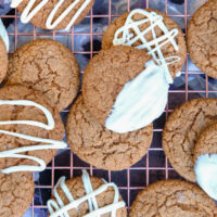 Crispy gingerbread cookies on a cooling rack.