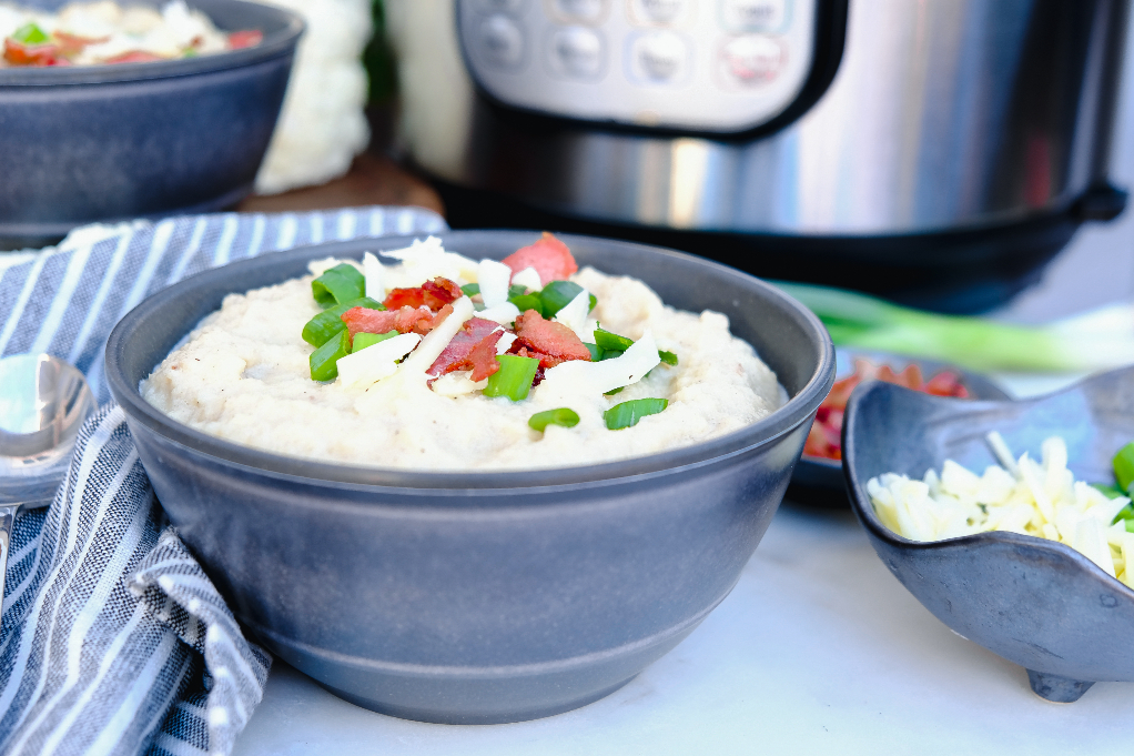 Horizontal view of creamy keto cauliflower soup made in an Instant Pot. 