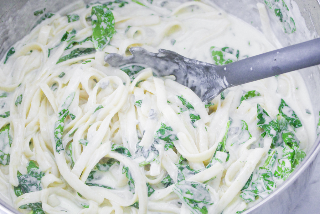 Alfredo sauce with fettuccini and spinach.