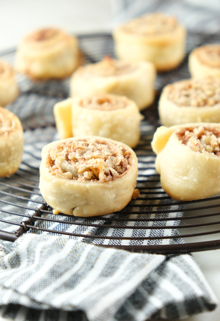 Pie crust cookies on a baking rack cooling.