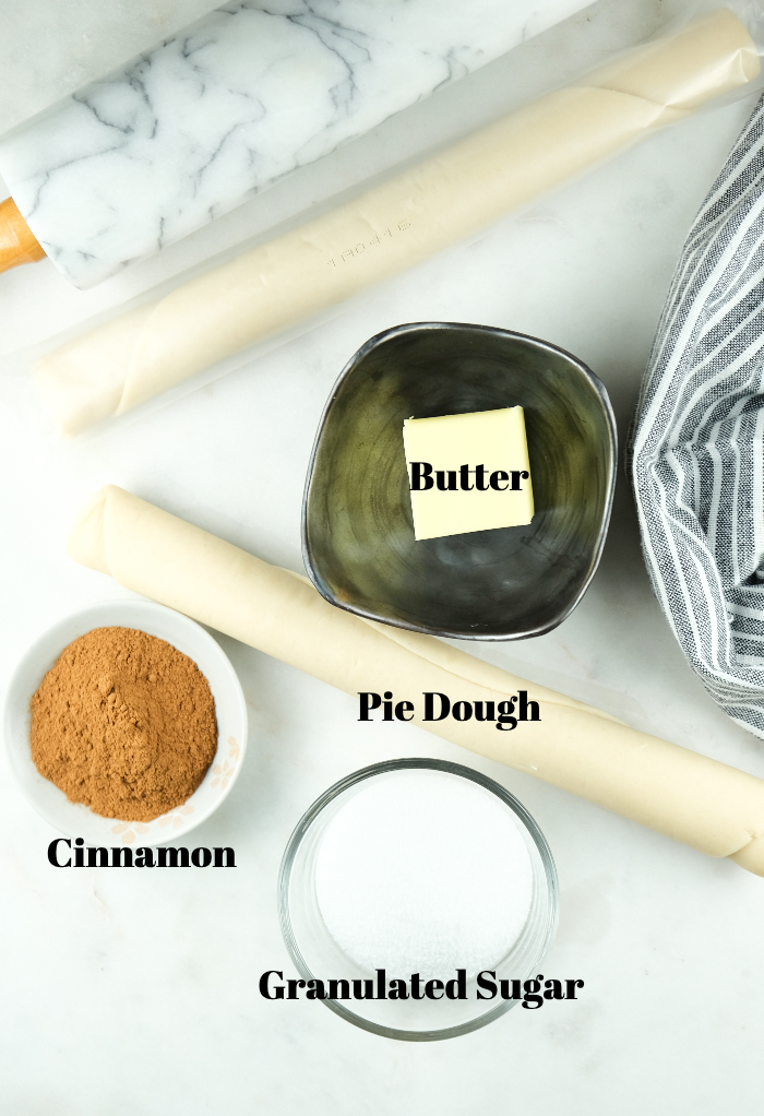 Ingredients to make cinnamon sugar pie crust cookies. 