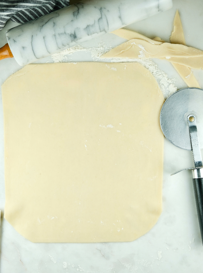 Trimming cookie dough with a pizza cutter