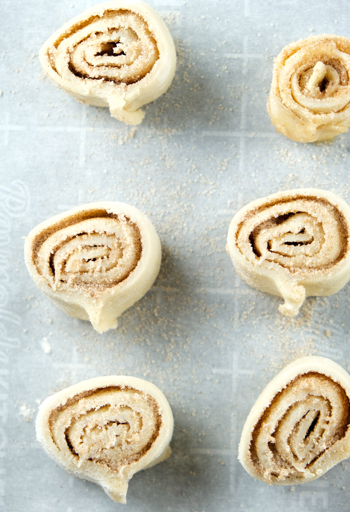 Pie crust cookies on parchment paper ready to bake. 