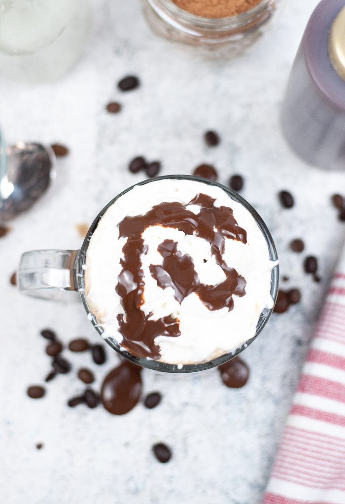 Top view of skinny mocha topped with whipped cream.