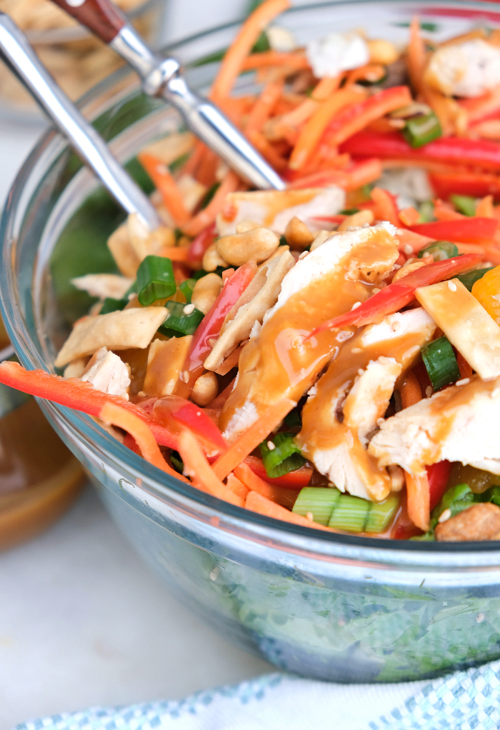 Healthy Chinese chicken salad in a clear salad bowl ready to be served. 