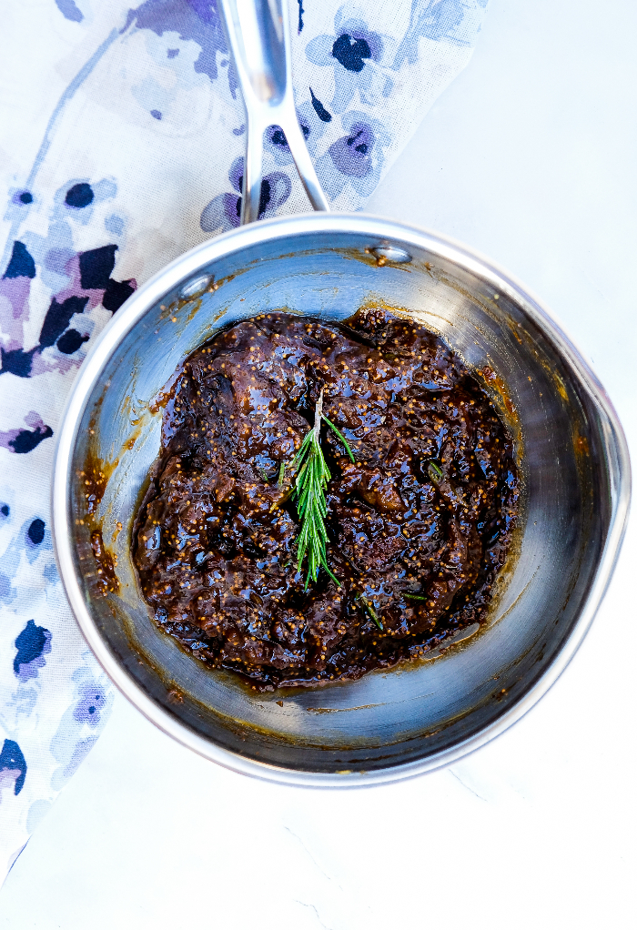 Warmed fig sauce in a small saucepan.