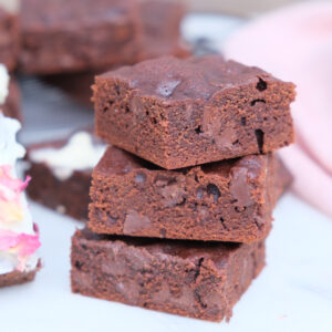 A stack of small batch brownies layered on top of each other.