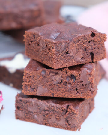 A stack of small batch brownies layered on top of each other.
