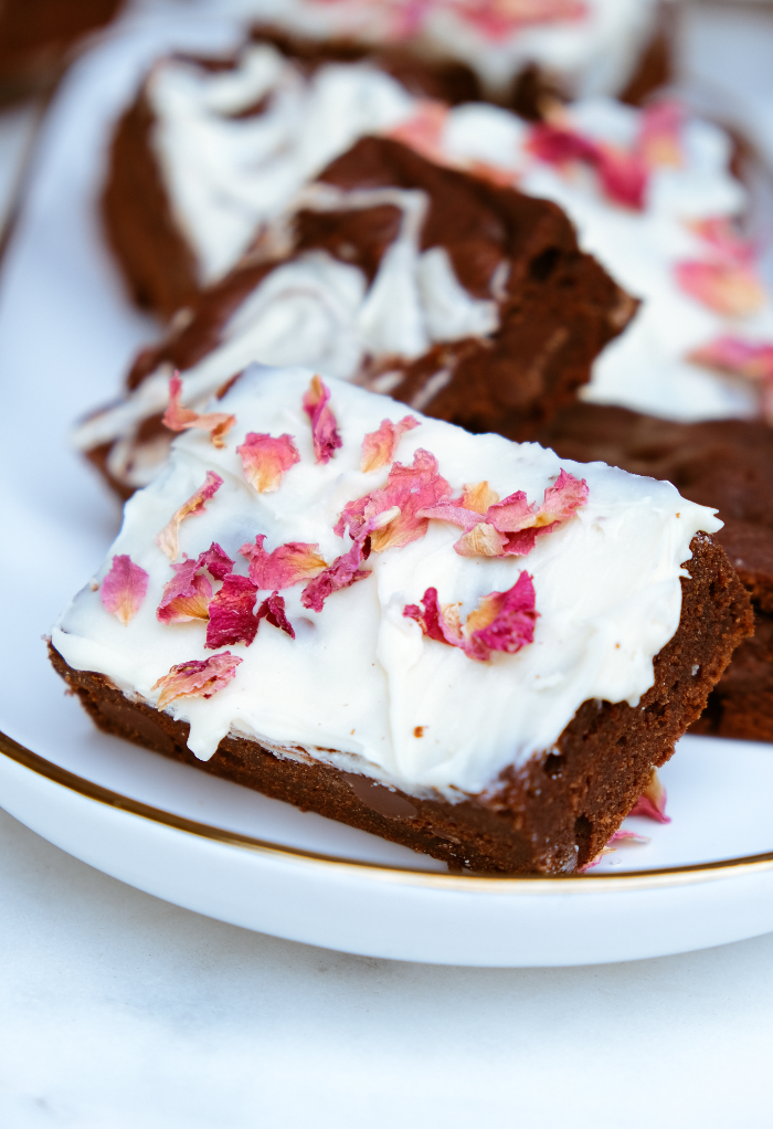 Small batch brownies made three ways on a white serving plate. 