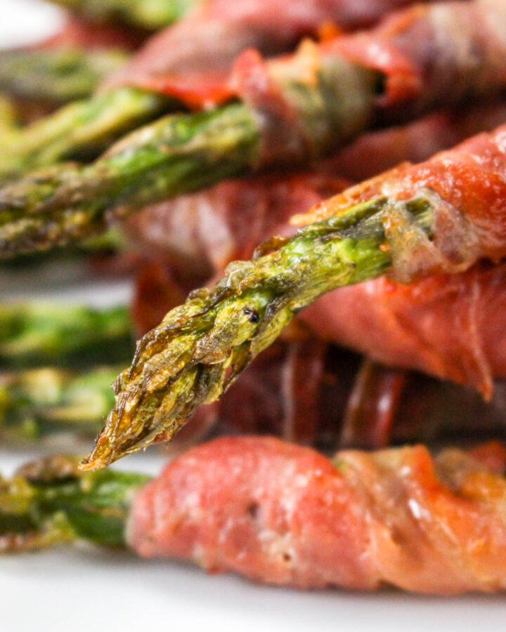 Fresh asparagus wrapped in prosciutto and baked until crispy.