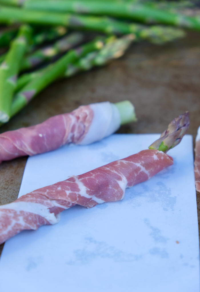 Wrapped prosciutto over asparagus before baking.