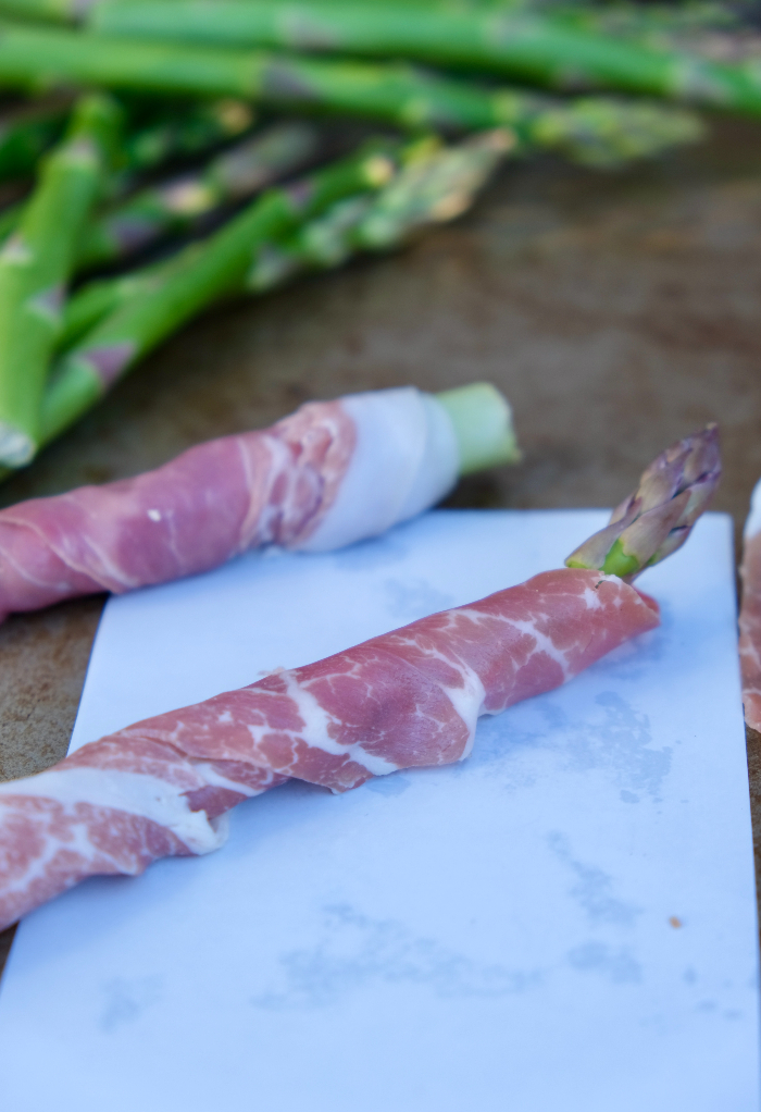 Wrapped prosciutto over asparagus before baking.