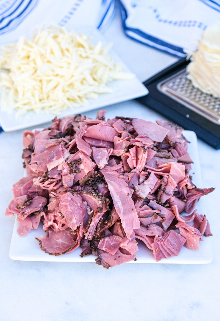 Chopped pastrami and shredded Swiss cheese.