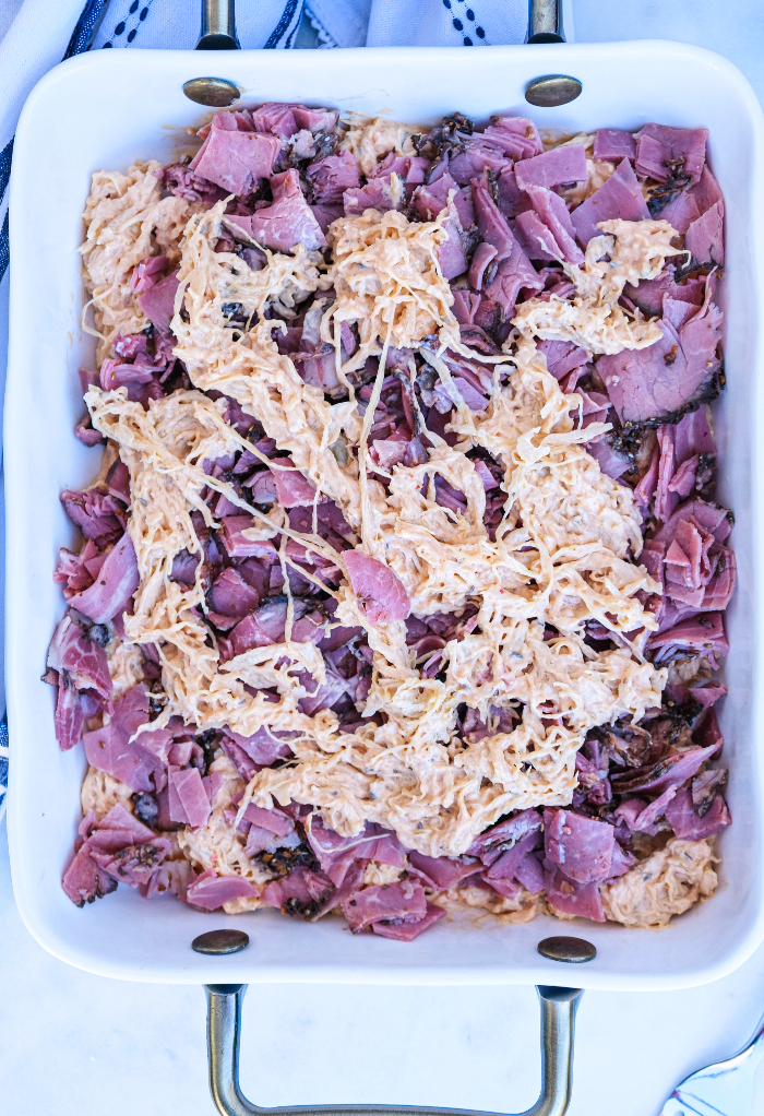 Layered rueben casserole before baking.