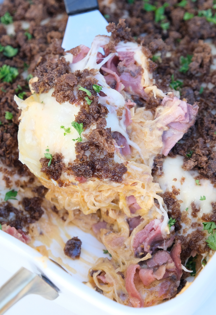 Homemade reuben casserole topped with rye bread ready to be plated.