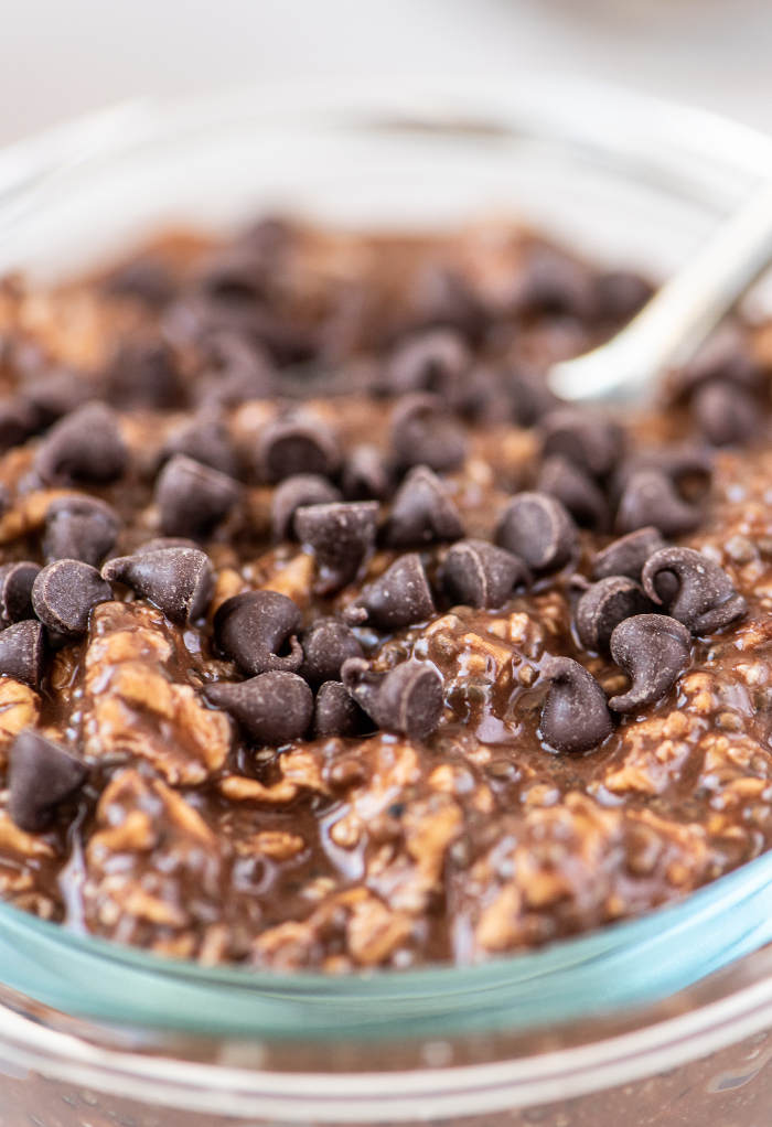 A close view of chocolate overnight oats with mini chocolate chips ready to eat. 