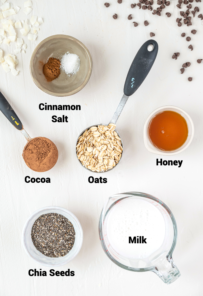 Top view of ingredients needed to make overnight oats with chocolate. 