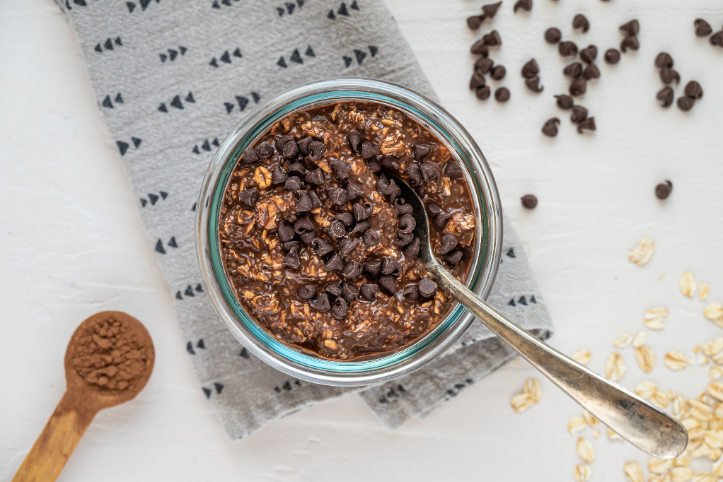 Overnight oats topped with chocolate chips in a small bowl.