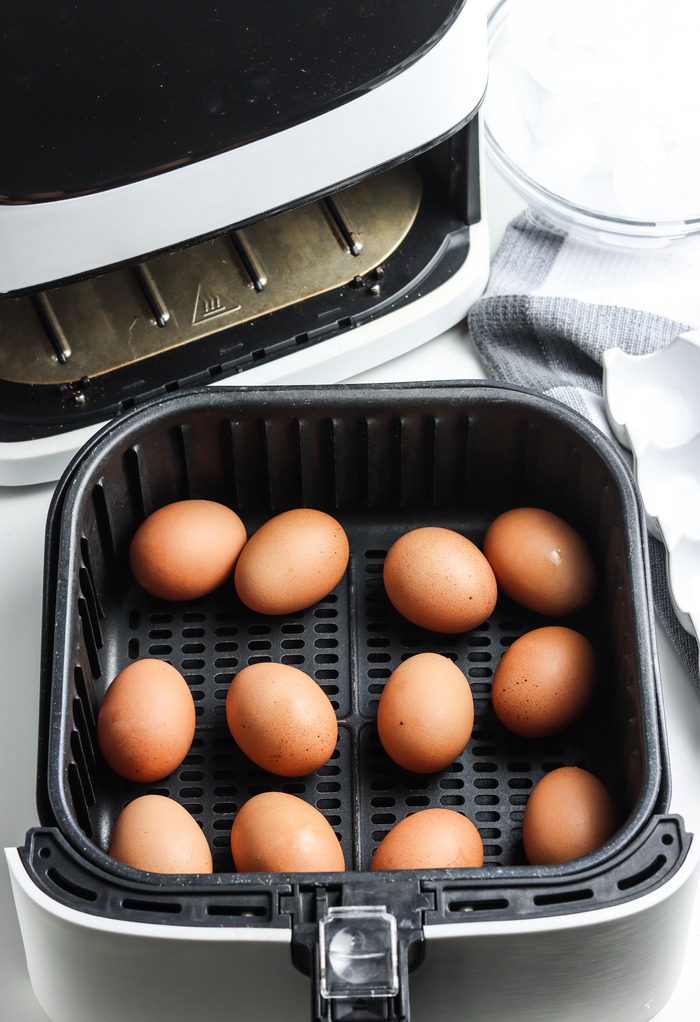 Eggs placed in an air fryer basket to hard boil. 