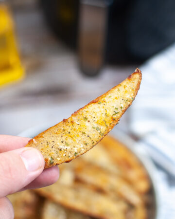 Potato wedge cooked in an air fryer.