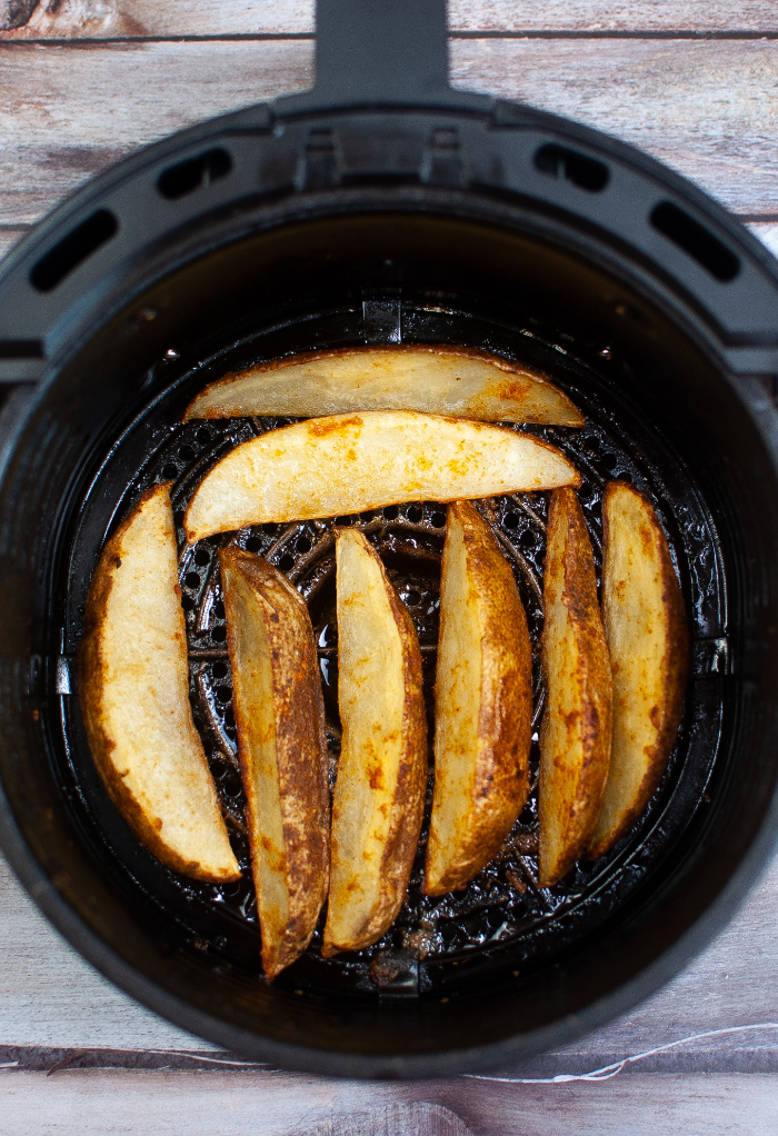 AirPotatoes in the basket of an air fryer. 