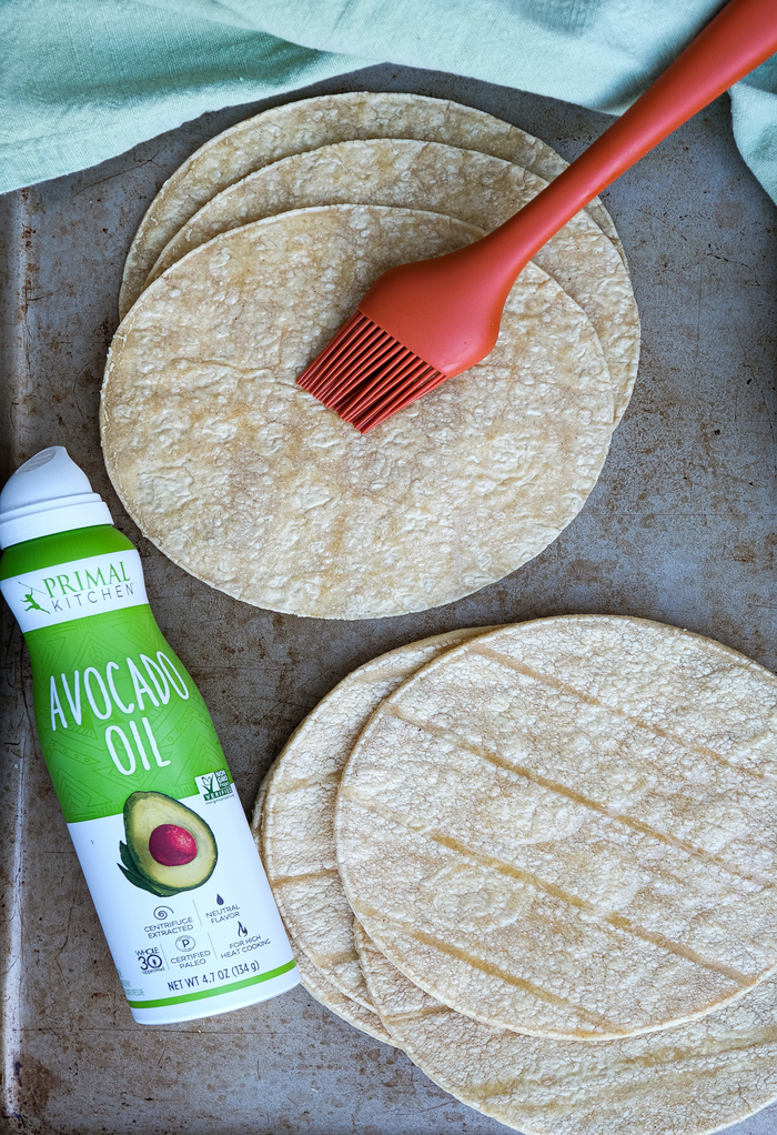 Lightly coating tortillas with avocado oil before baking them. 