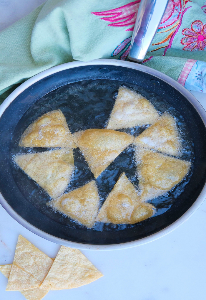 Frying tortillas in a skillet.