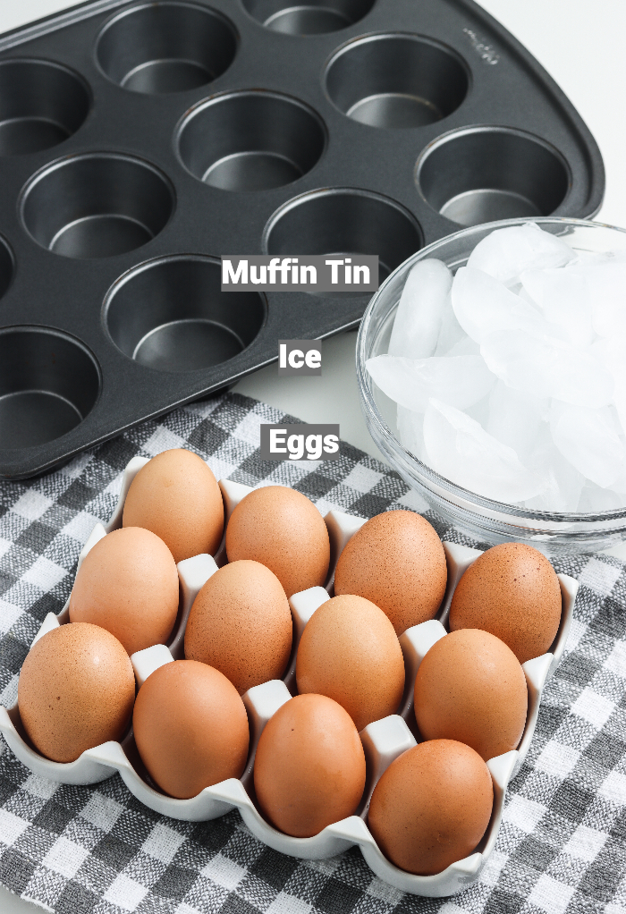 Ingredients and kitchen tools needed to make oven cooked hard boiled eggs. 