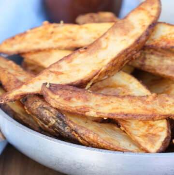 Cooked potatoes in a small serving dish ready to eat.