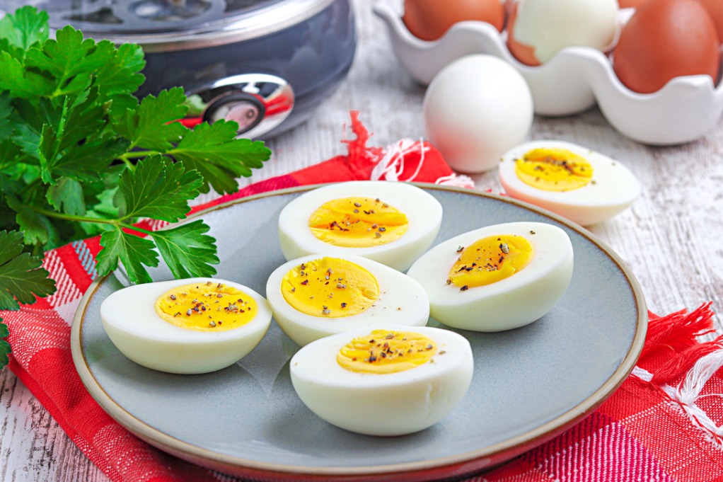 Egg cooker eggs ready to enjoy on a gray plate. 