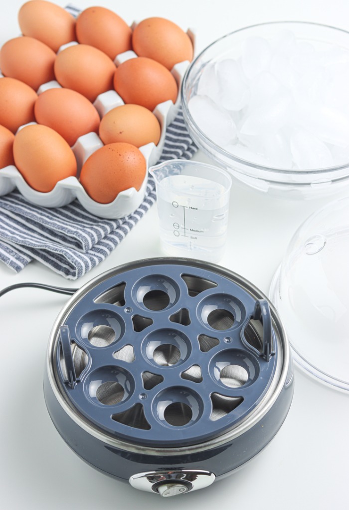 Preparing egg cooker to make boiled eggs. 